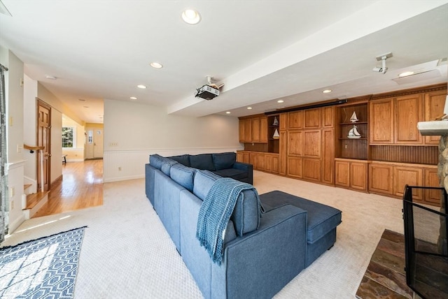 328 Central Ave, Scituate, MA 02050 - living area with light carpet, recessed lighting, light wood-style floors, and a wainscoted wall