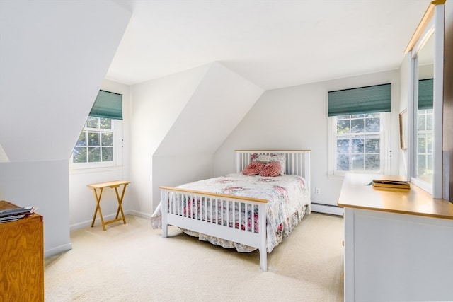 carpeted bedroom featuring lofted ceiling, multiple windows, and baseboard heating