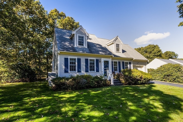 cape cod-style house with a front yard