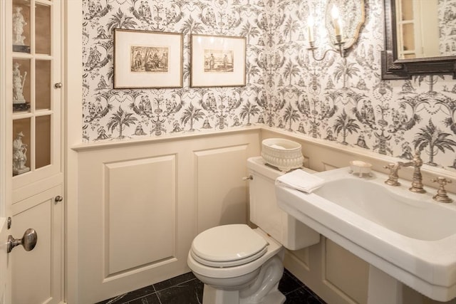 bathroom featuring tile patterned floors and toilet