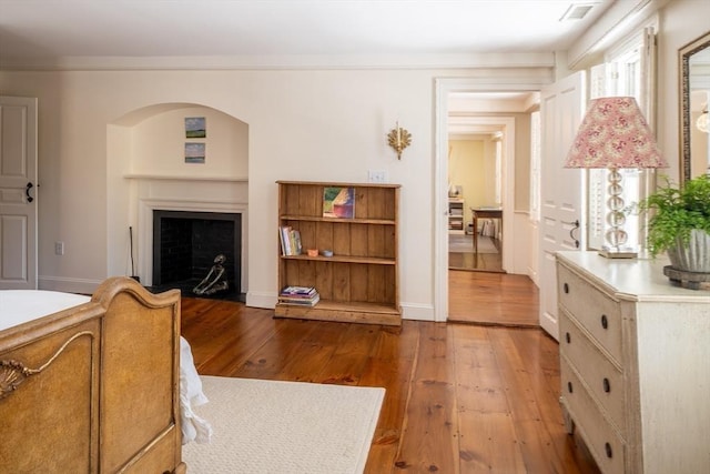 interior space with crown molding and hardwood / wood-style floors