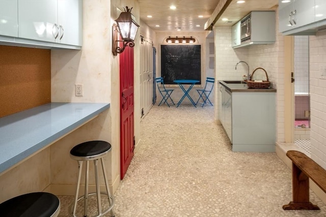 kitchen featuring tasteful backsplash and sink