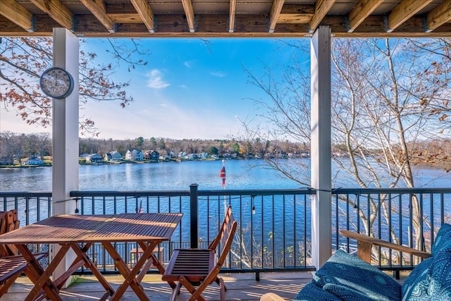 wooden terrace with a water view