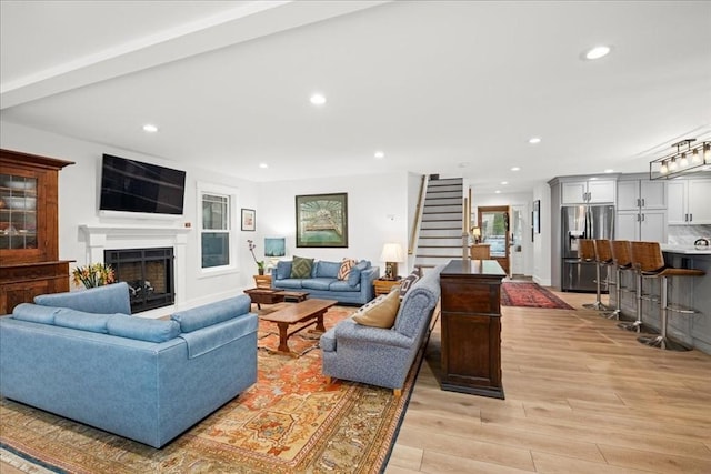 living room with light hardwood / wood-style flooring