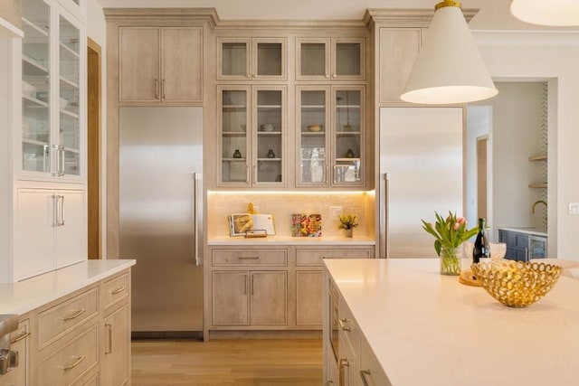 234 Valley Rd, Needham, MA 02492 - bar with pendant lighting, backsplash, light wood-style floors, and built in fridge