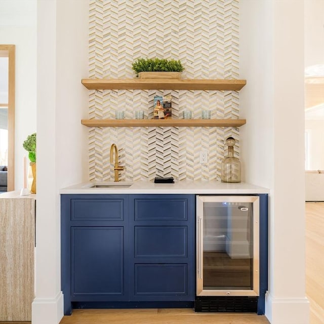 234 Valley Rd, Needham, MA 02492 - bar with a sink, wet bar, decorative backsplash, and beverage cooler