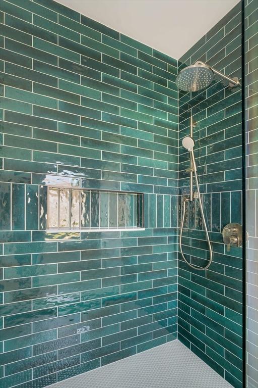 234 Valley Rd, Needham, MA 02492 - bathroom featuring a tile shower