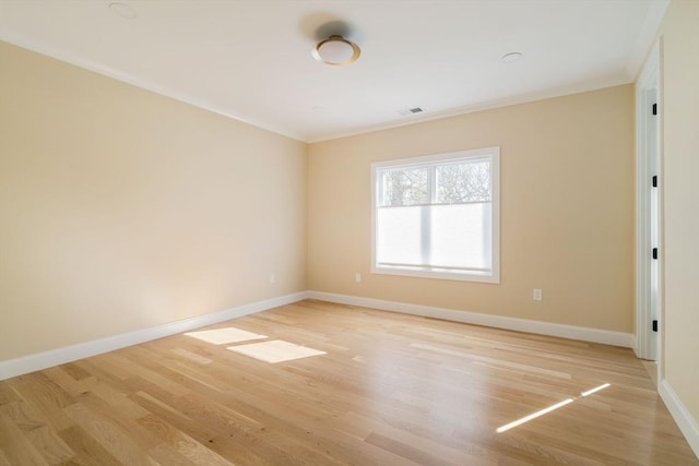 234 Valley Rd, Needham, MA 02492 - empty room with visible vents, ornamental molding, light wood finished floors, and baseboards