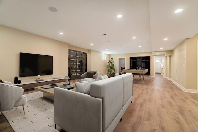 234 Valley Rd, Needham, MA 02492 - living area with recessed lighting, baseboards, and light wood-style floors