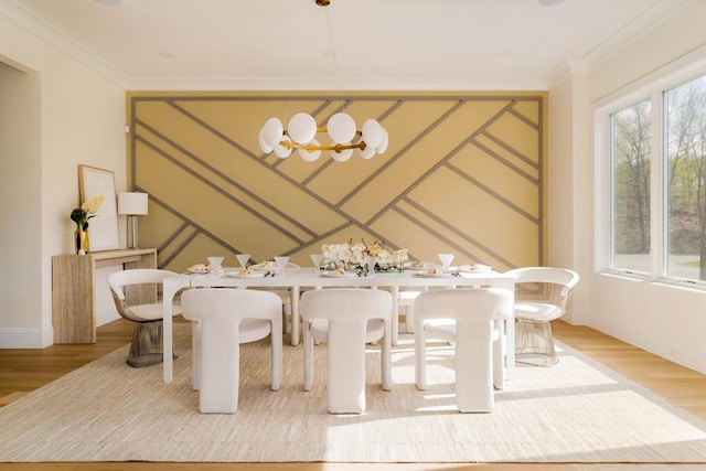 234 Valley Rd, Needham, MA 02492 - dining area with a decorative wall, light wood-type flooring, and crown molding