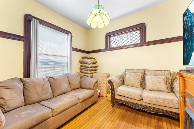 living room featuring a wealth of natural light and hardwood / wood-style flooring