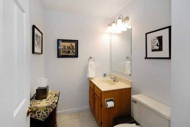 bathroom with tile patterned floors, vanity, and toilet