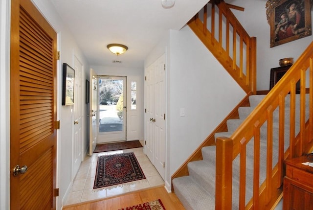 entryway featuring light tile patterned floors