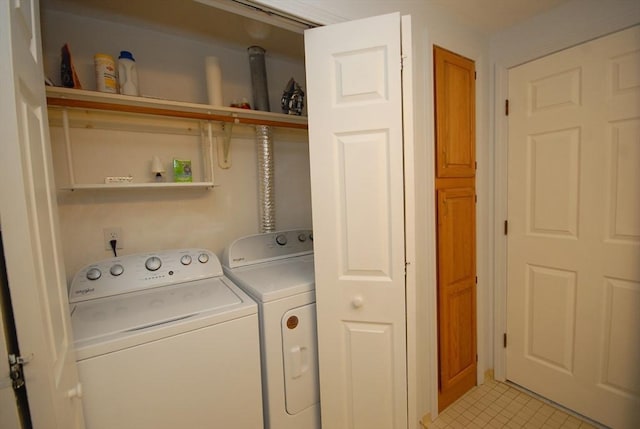 laundry room with washer and clothes dryer