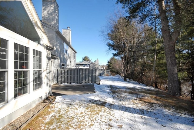 view of yard covered in snow