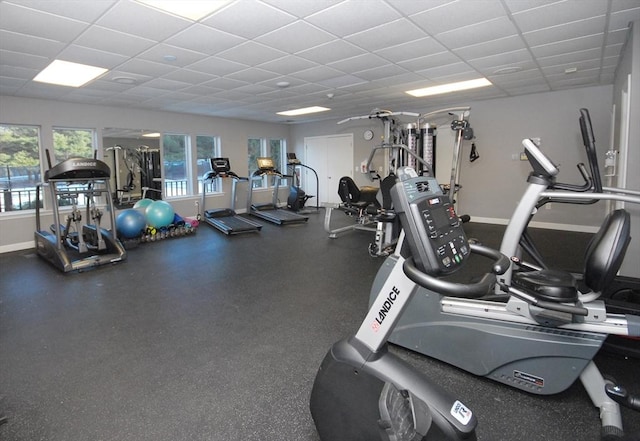 exercise room featuring a drop ceiling