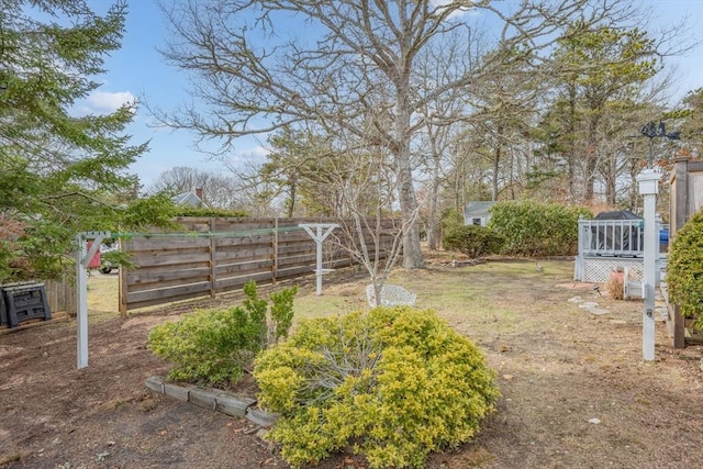 view of yard with a garden and fence