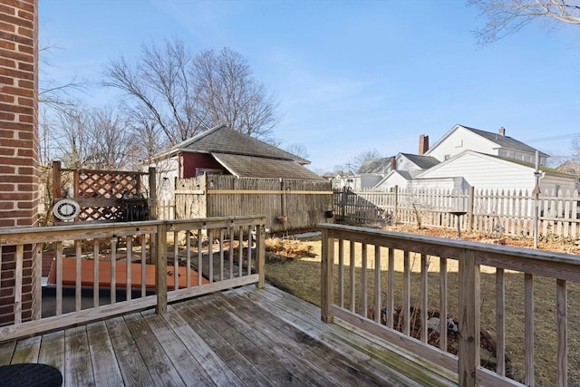 wooden deck featuring a fenced backyard