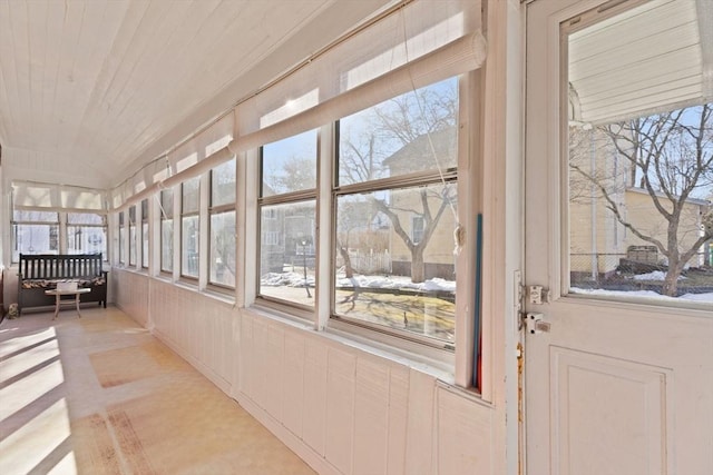 sunroom with wood ceiling and plenty of natural light