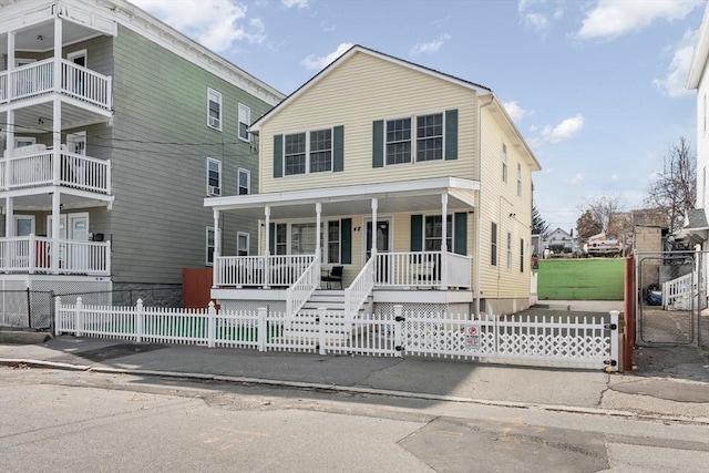 view of front facade with a fenced front yard and a porch