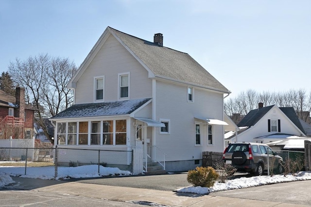 back of house with a sunroom