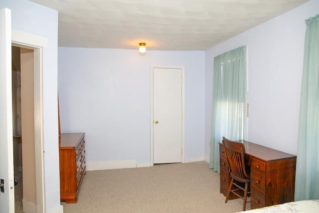 bedroom with light colored carpet