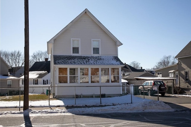 view of front of property featuring a carport