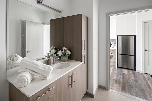 bathroom featuring hardwood / wood-style floors and vanity