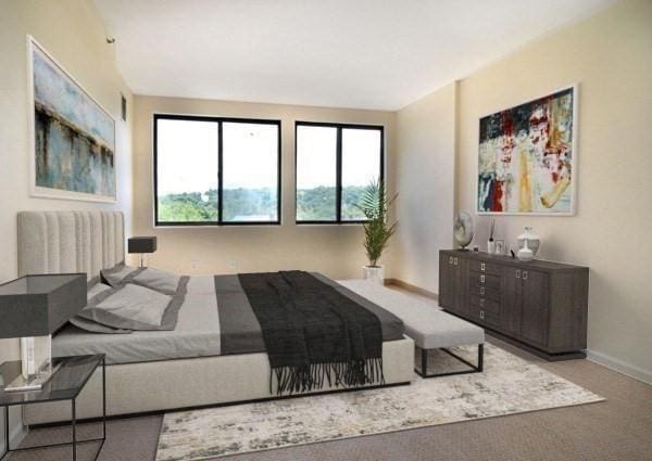 bedroom featuring baseboards and carpet