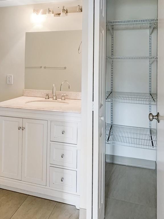 bathroom featuring tile patterned floors and vanity