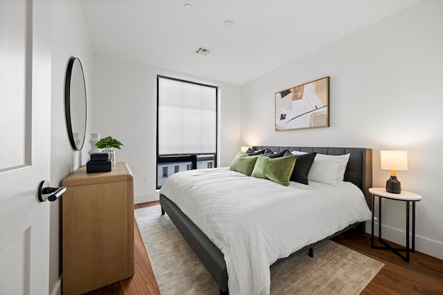 bedroom featuring dark wood-type flooring