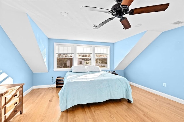 bedroom with ceiling fan and light hardwood / wood-style flooring