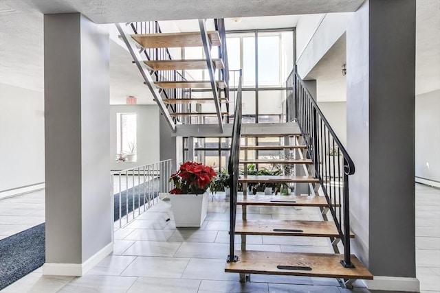 stairs with tile patterned flooring