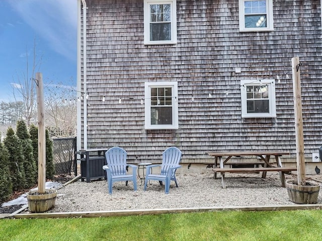 back of property featuring a patio area