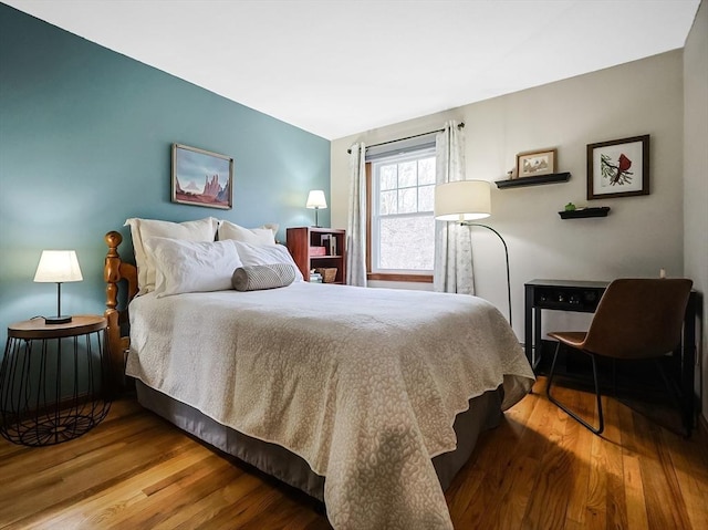 bedroom featuring wood finished floors