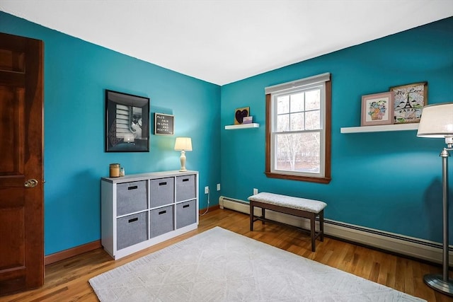 interior space with baseboards and wood finished floors