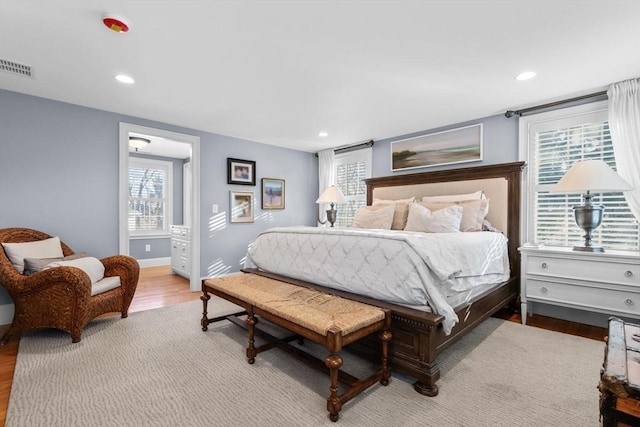 bedroom with light hardwood / wood-style flooring