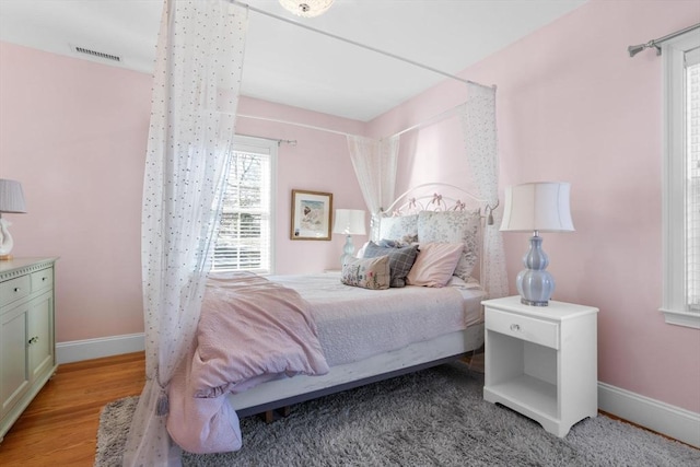 bedroom with light hardwood / wood-style floors