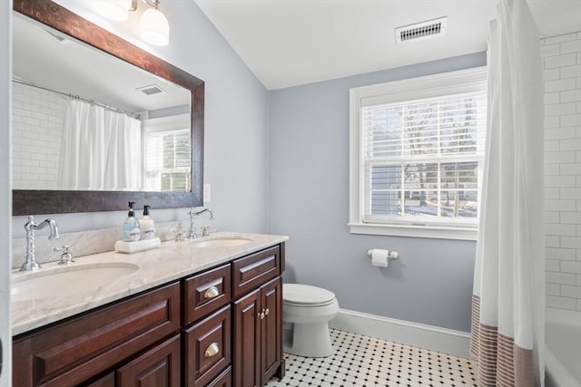 full bathroom featuring shower / bathtub combination with curtain, vanity, and toilet