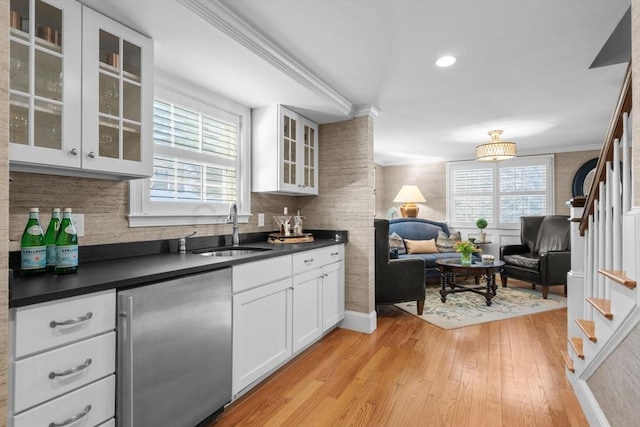 kitchen featuring white cabinetry, plenty of natural light, sink, and high end refrigerator