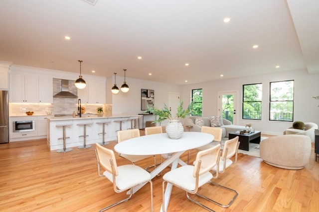 dining room with light wood-type flooring