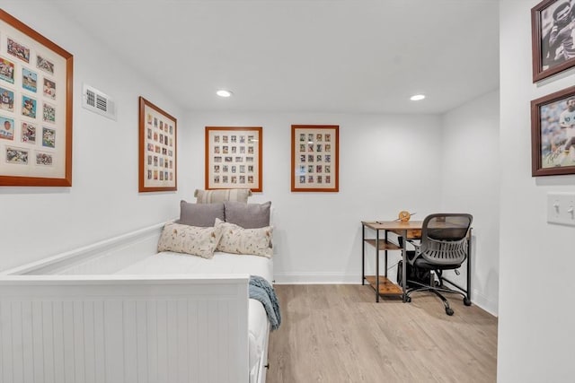 bedroom with recessed lighting, visible vents, baseboards, and wood finished floors