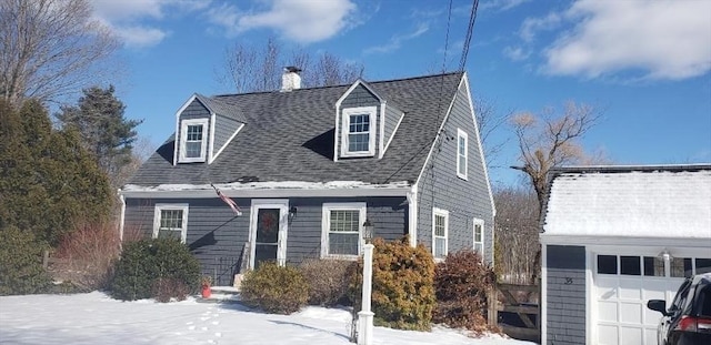 cape cod home with a chimney and a shingled roof