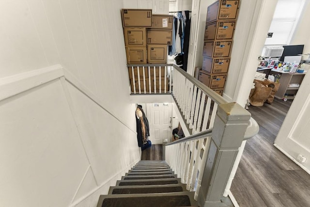 stairs with wood finished floors