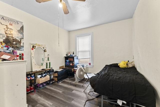 bedroom featuring ceiling fan and wood finished floors