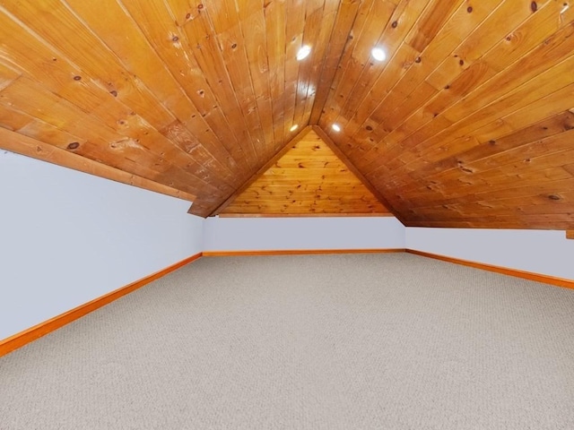 additional living space featuring lofted ceiling, wooden ceiling, carpet flooring, and baseboards