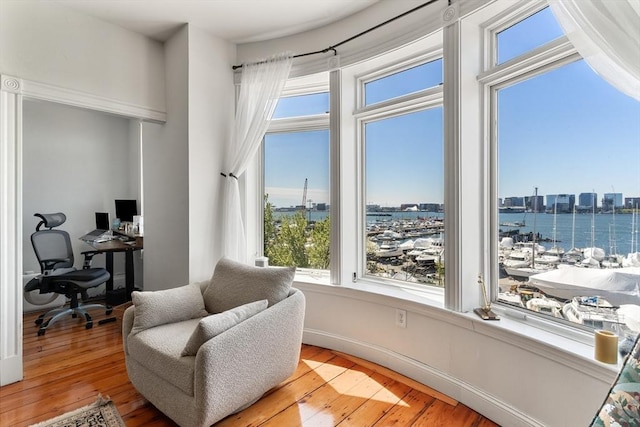 6 Brigham St Unit 2, Boston, MA 02128 - living area with an office area, a water view, and light wood finished floors
