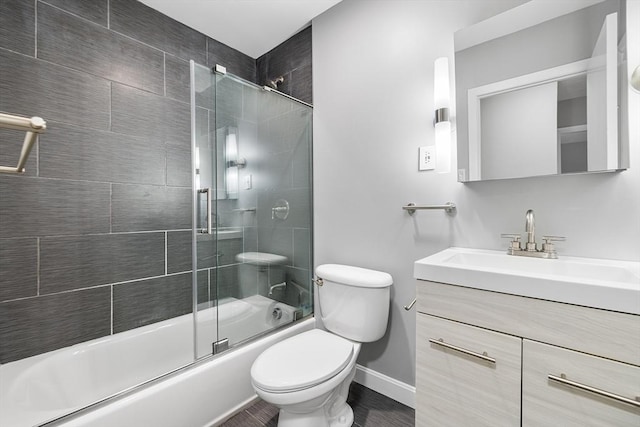 11 Cogswell Ave Unit 16, Cambridge, MA 02140 - full bath with toilet, vanity, bath / shower combo with glass door, and baseboards