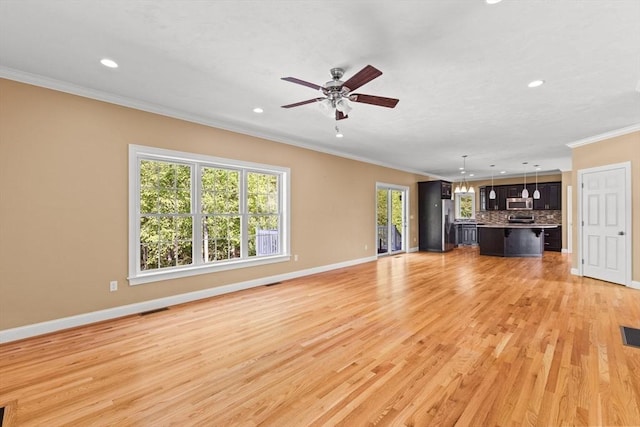 unfurnished living room with crown molding, recessed lighting, baseboards, ceiling fan, and light wood-style floors