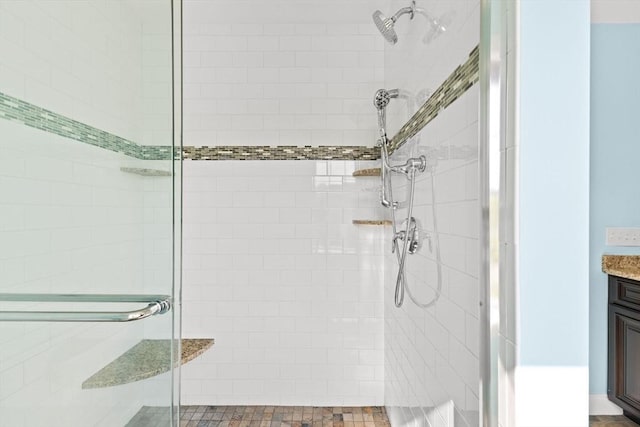 full bath featuring a shower stall and vanity
